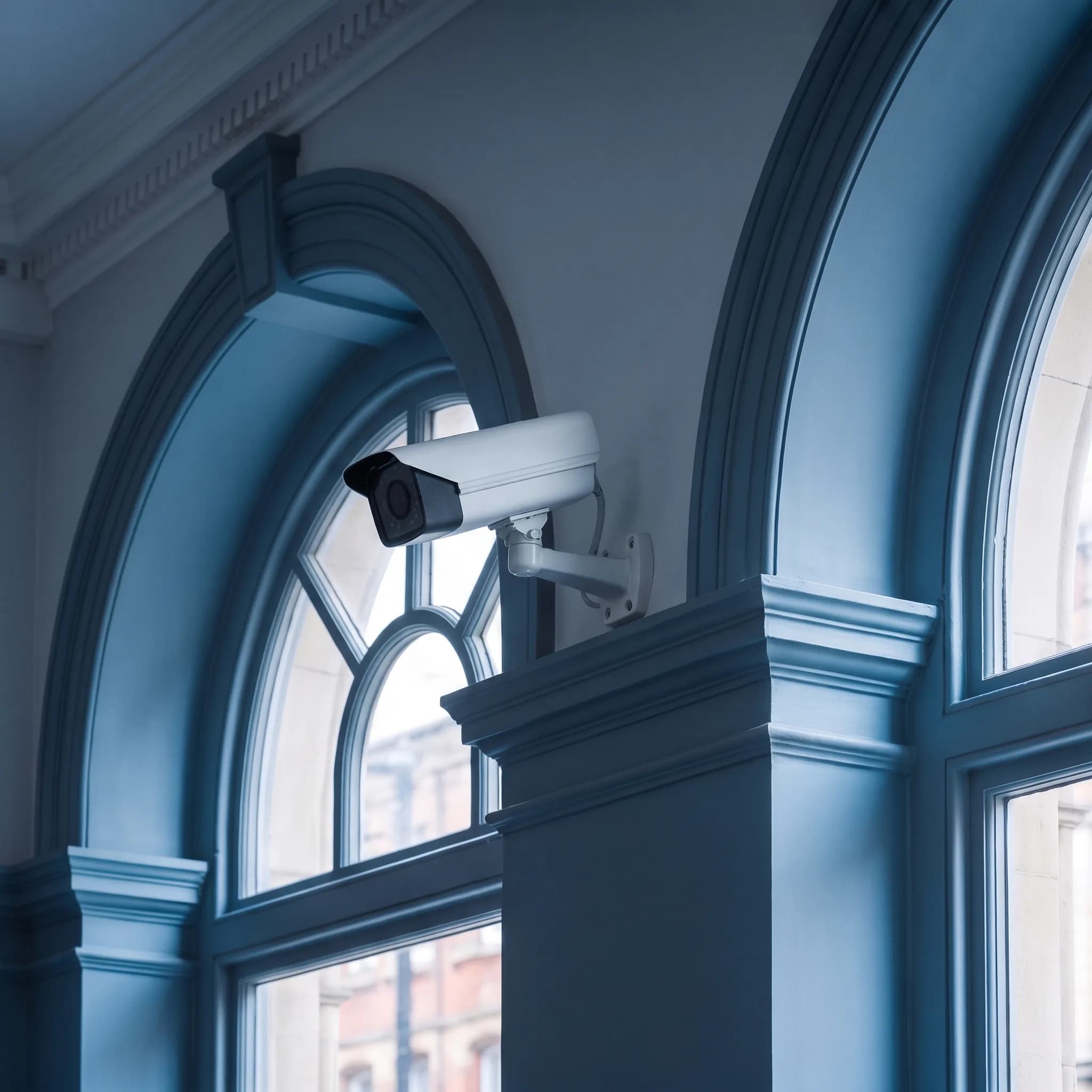 CCTV bullet camera mounted on the exterior of a building