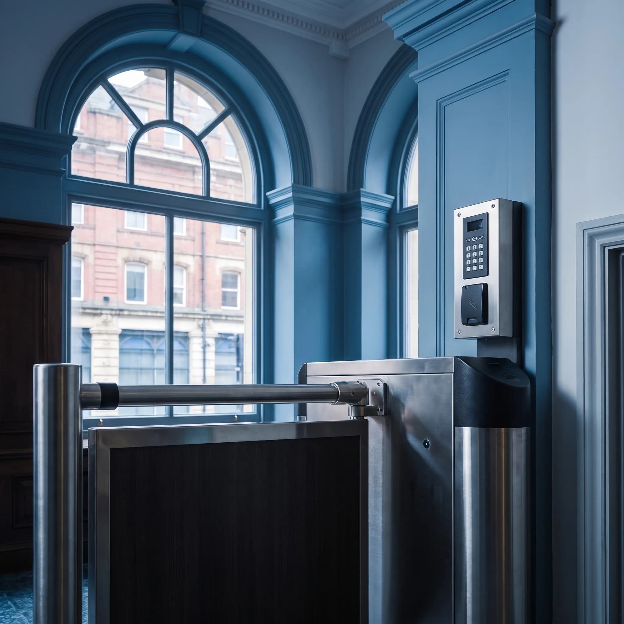 Automatic security barrier and access control keypad at a building entrance