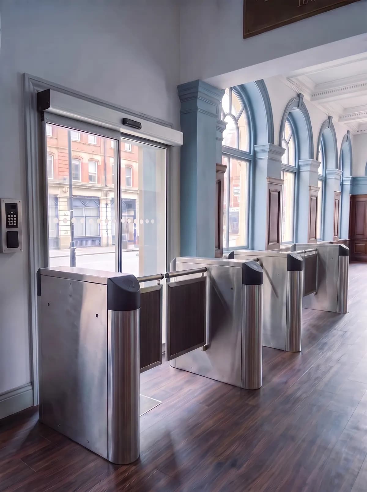 Stainless steel entrance gates installed in a building lobby