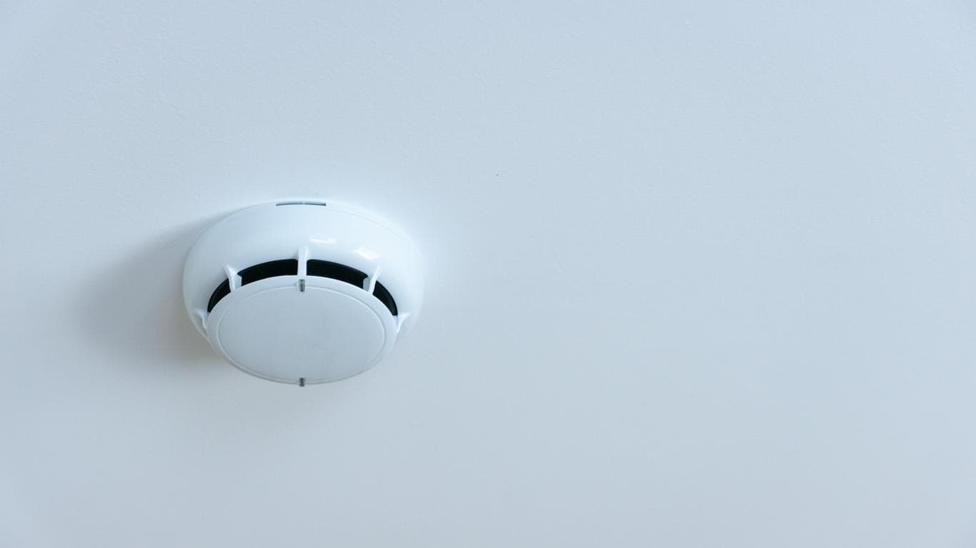 In office spaces, smoke detectors should be installed in common areas like meeting rooms, hallways, and near break rooms