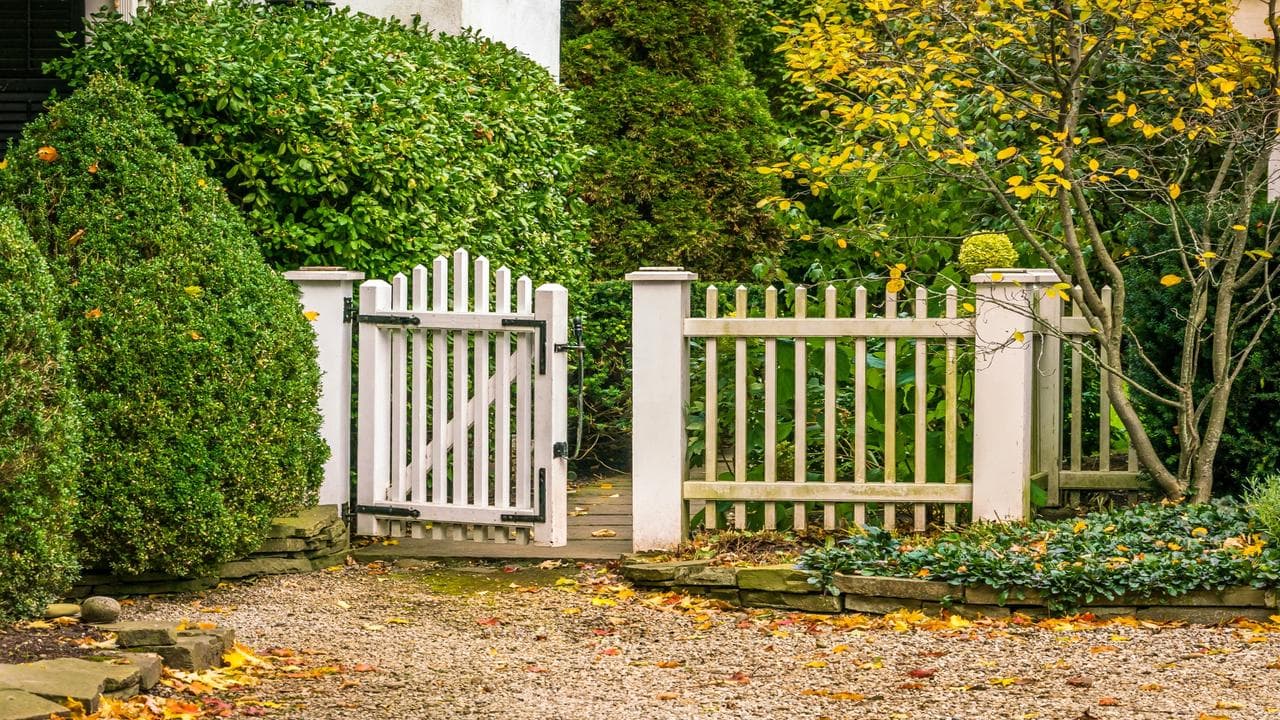 A secure garden gate starts with the right foundation: its material and design.