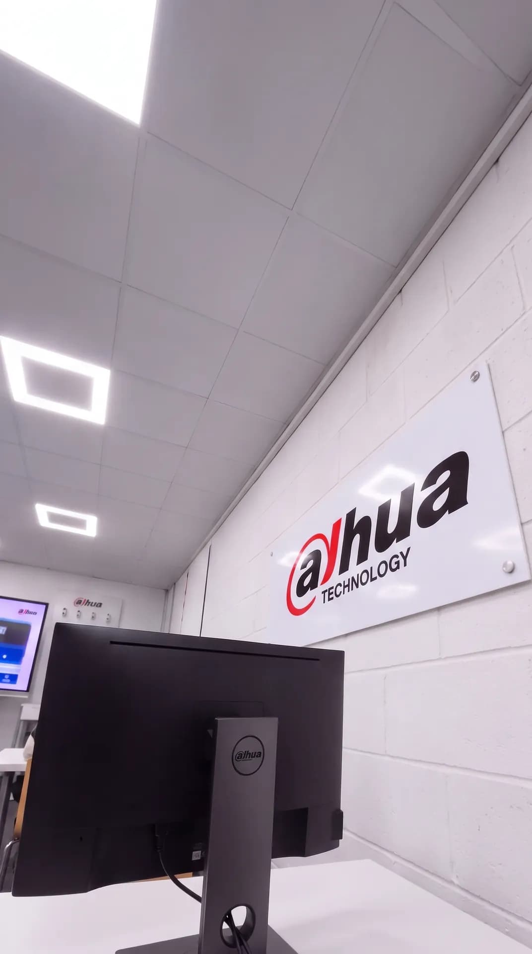 Training room with a monitor and a wall sign