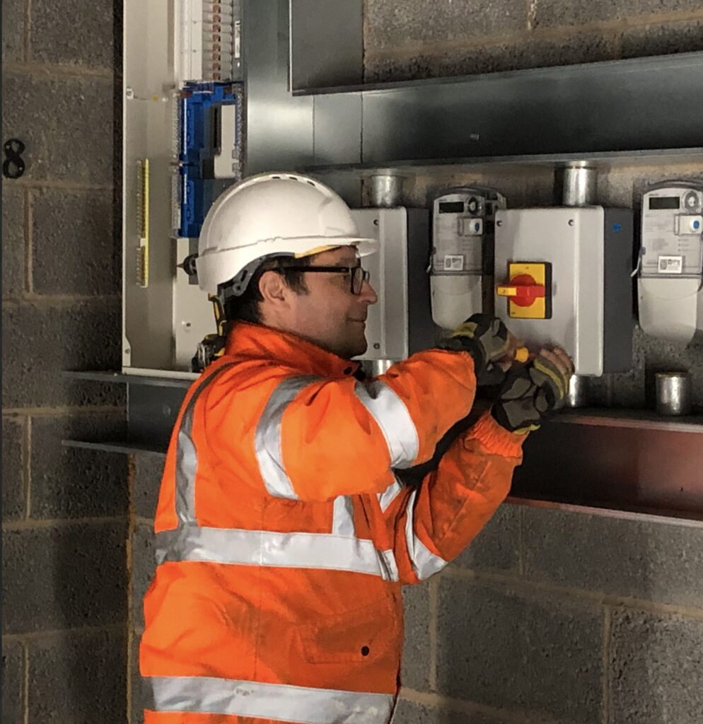 a man showing commercial intruder alarm installation