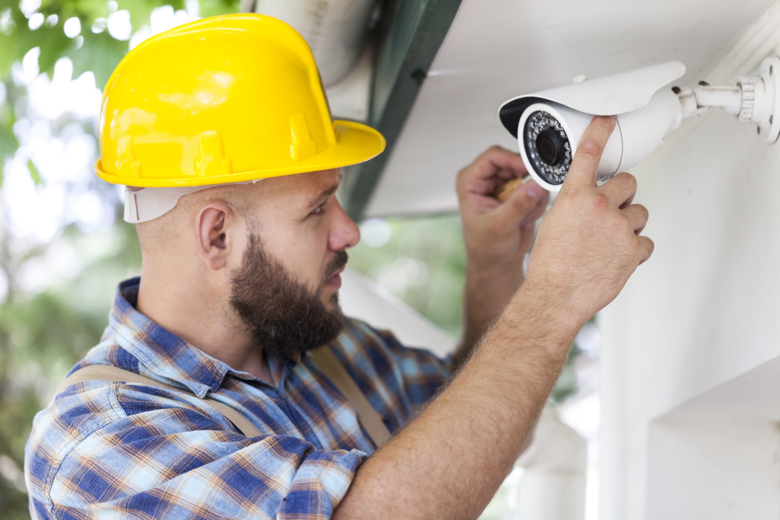 a man servicing a cctv camera