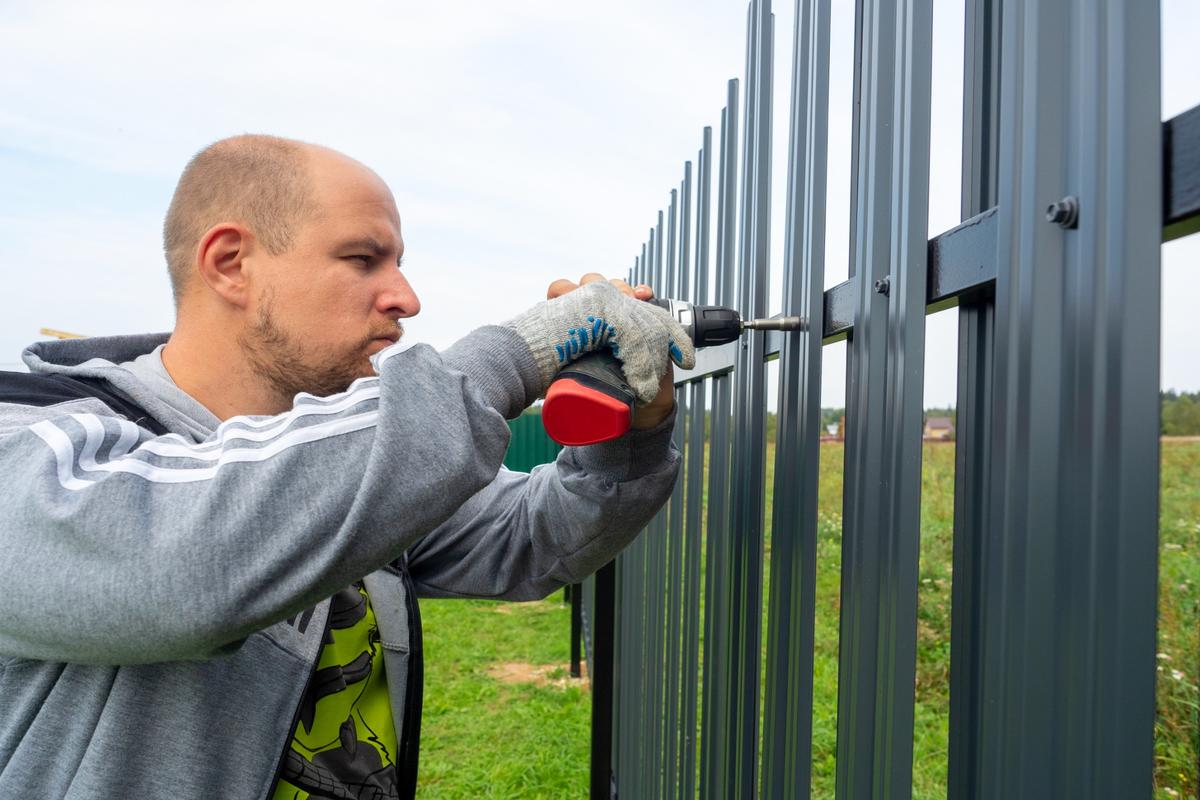 security gate needs repair being fixed my an expert