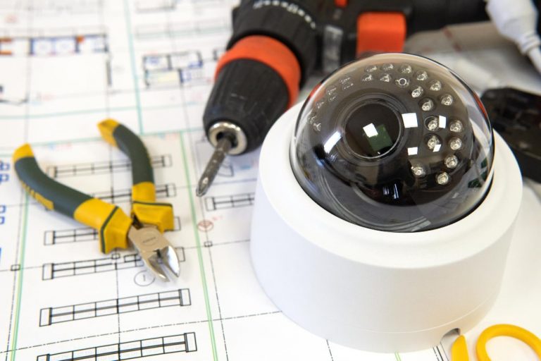CCTV installation engineer setting up security cameras