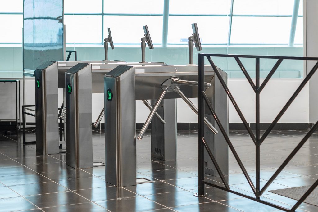 Entrance turnstiles with display reading visitors face min 1024x683